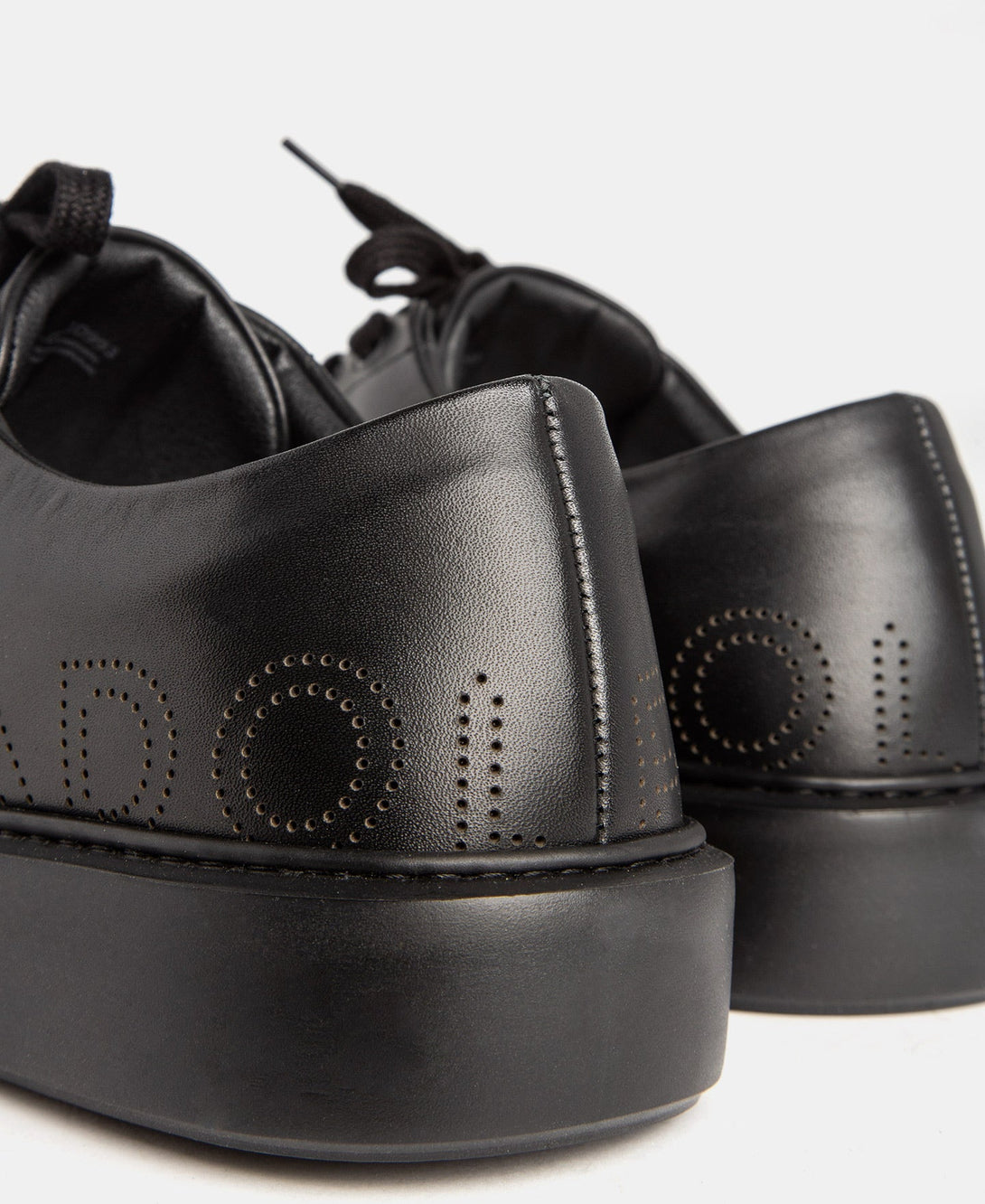 Men Shoes | Black Die-Cut Logo Sneaker by Spanish designer Adolfo Dominguez