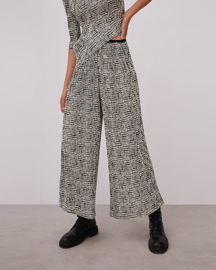 Women Trousers | White And Black Crinkle Trousers With Signature Print by Spanish designer Adolfo Dominguez